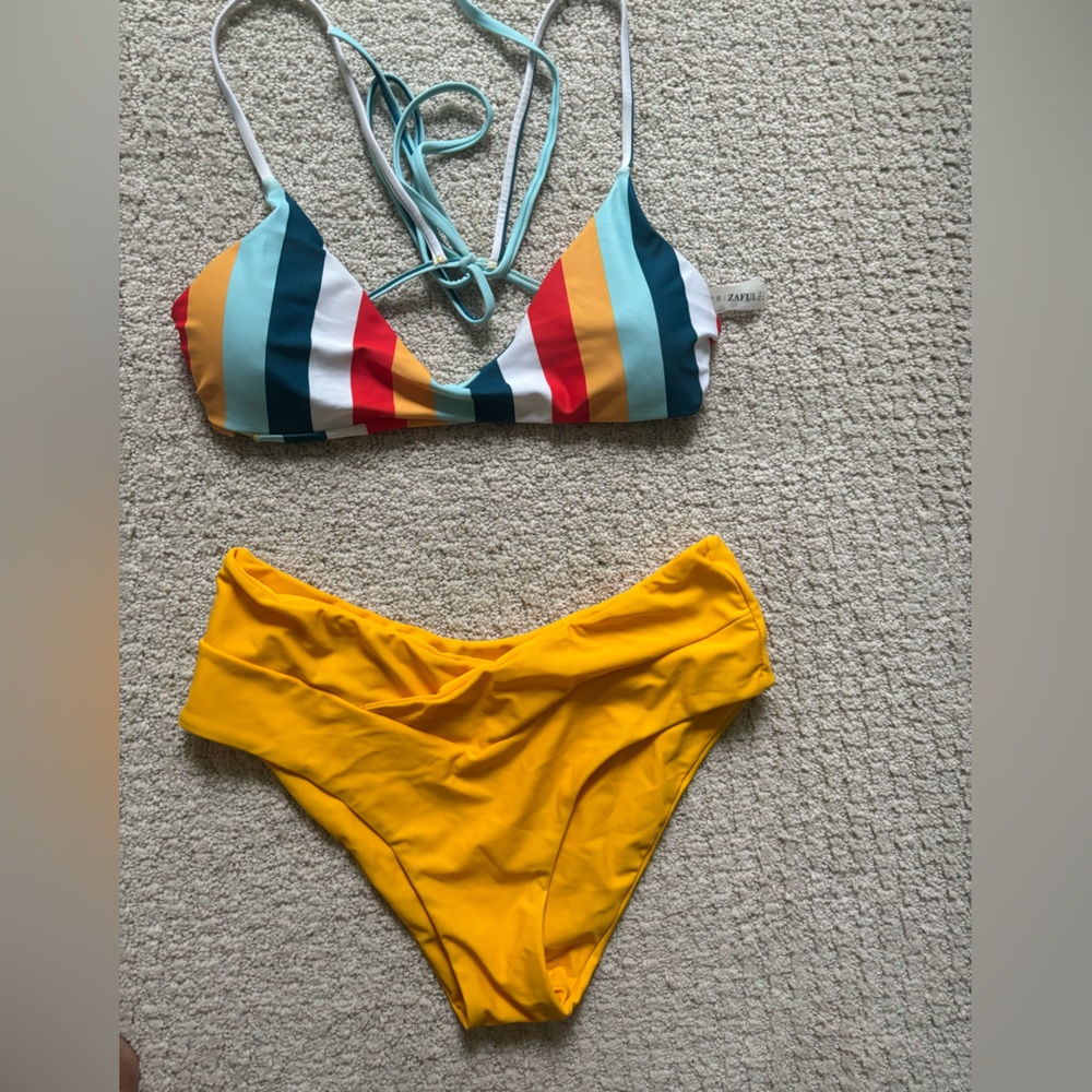 Striped bikini top & yellow high-waisted bottoms